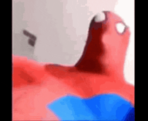 a close up of a spider man costume with his mouth open