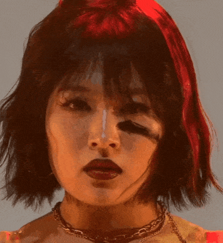 a close up of a woman 's face with the words cute a on the bottom right
