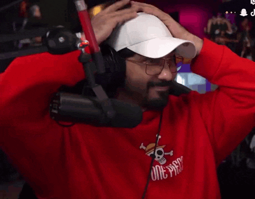 a man wearing headphones and a one piece sweatshirt