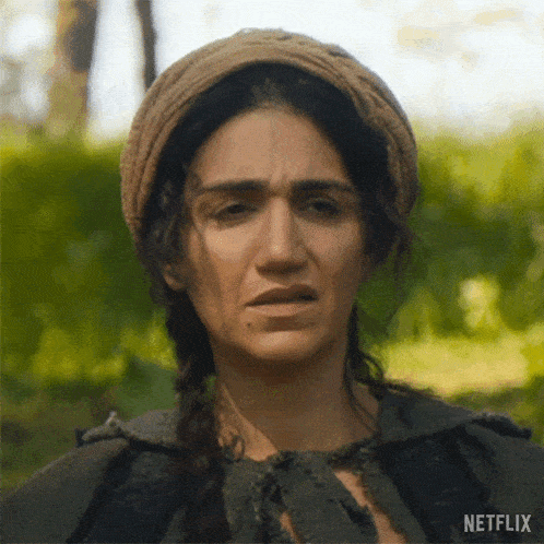 a close up of a woman 's face with a netflix logo on the bottom