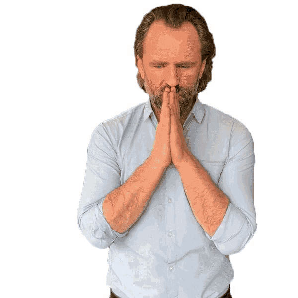a man with a beard is praying with his hands folded