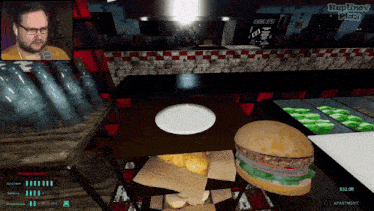 a man is playing a video game where a hamburger costs $32.00