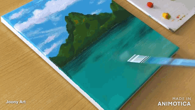 a painting by joony art is being painted on a canvas