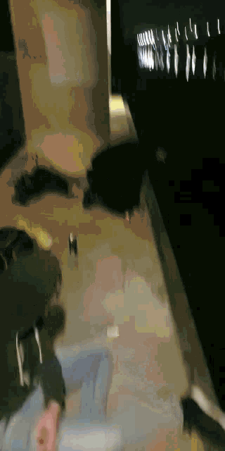 a blurred image of a person laying on the floor