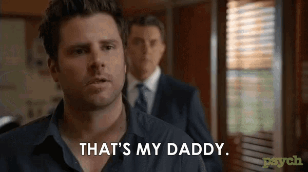 a man is saying that 's my daddy while standing next to another man in a suit .