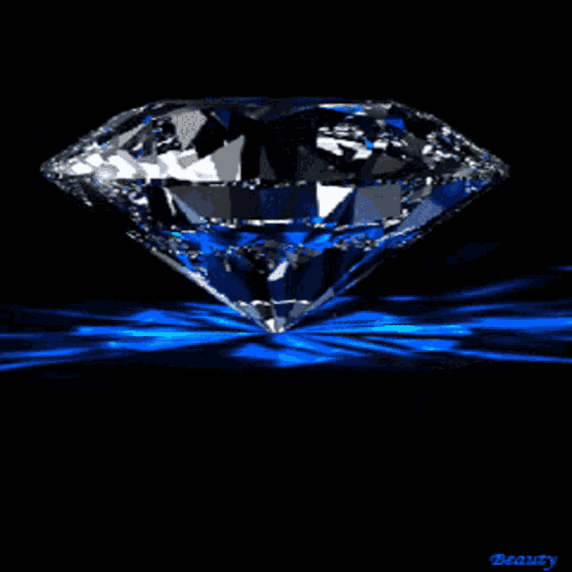 a diamond on a black background with the word beauty underneath it