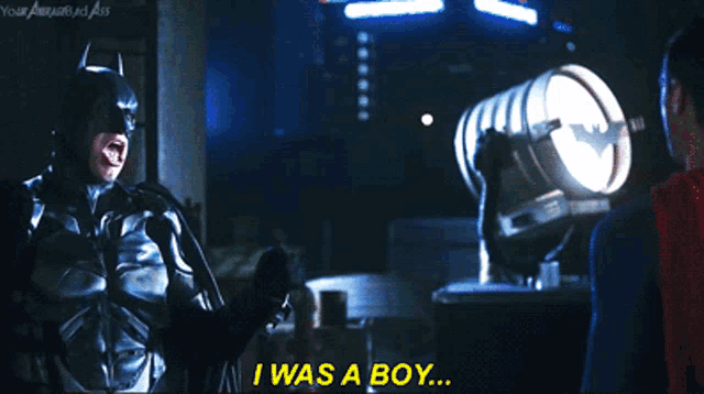 a batman says i was a boy while standing next to superman