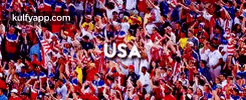 a crowd of people in red white and blue with the word usa on the top