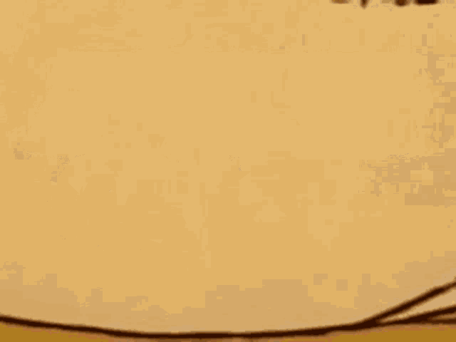 a close up of a cartoon drawing of a box on a table .
