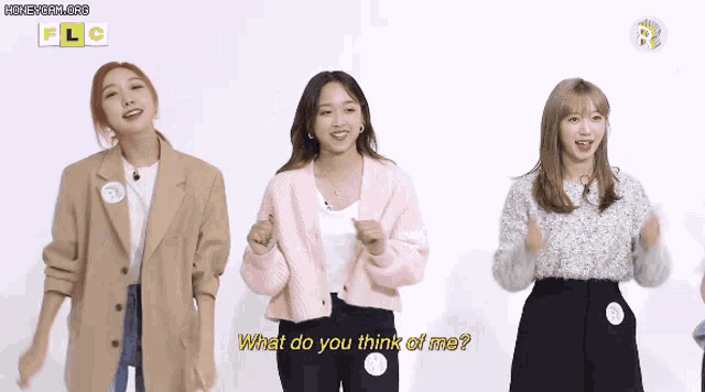 three women are standing next to each other and one of them says what do you think of me