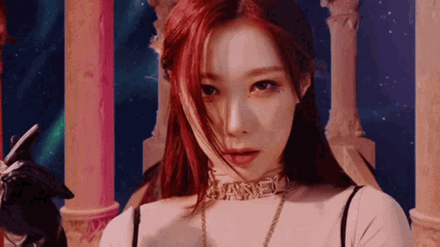 a close up of a woman with red hair wearing a choker necklace and gloves .