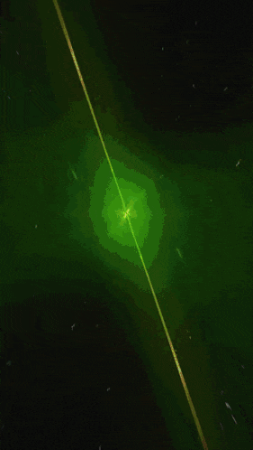 a green background with a white light in the center