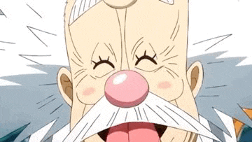a close up of a cartoon character with a white beard and a pink nose sticking his tongue out .