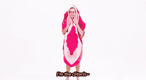 a man is wrapped in a pink towel that looks like a woman 's vagina .