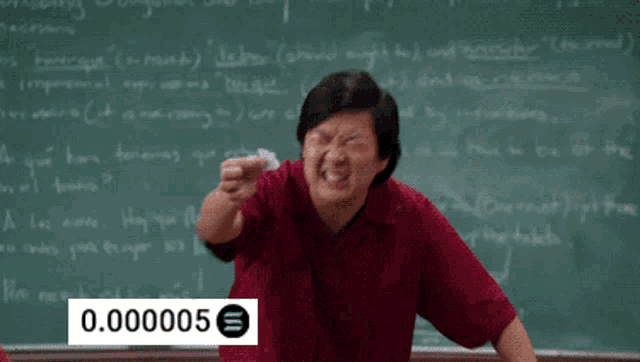 a man in front of a blackboard with the number 0.000005