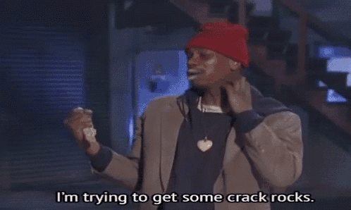 a man wearing a red beanie and a jacket says i 'm trying to get some crack rocks