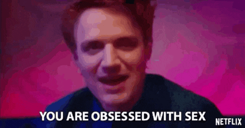 a close up of a man 's face with the words `` you are obsessed with sex '' written on the bottom .