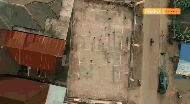 an aerial view of a tennis court with a tempo channel advertisement