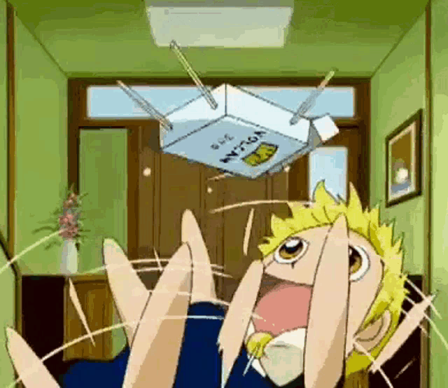 a cartoon character is holding a box that says nissan on it .