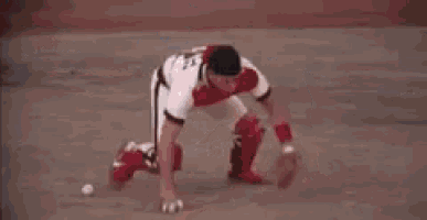 a baseball player with the number 32 on his jersey is sliding into base