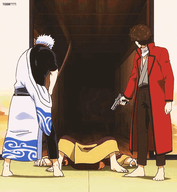 a man in a red coat is pointing a gun at another man laying on the ground