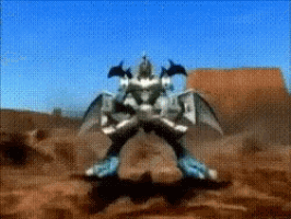 a robot with wings is standing in a desert