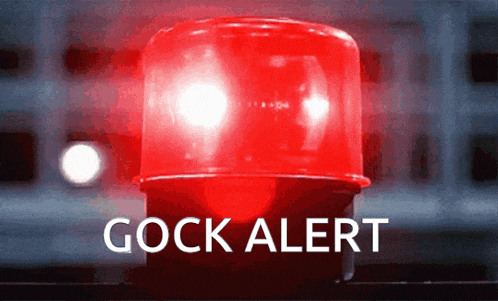 a red light with the words cock alert written on it