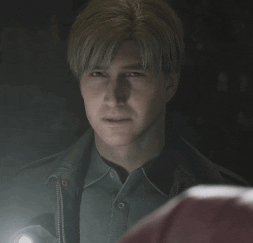 a man holding a flashlight looks at another man in a dark room