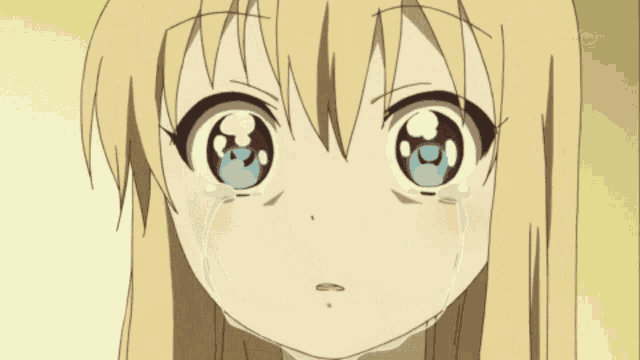 a blonde anime girl with blue eyes is crying