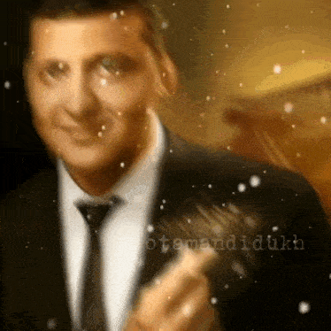 a man in a suit and tie is holding a fork in his hand
