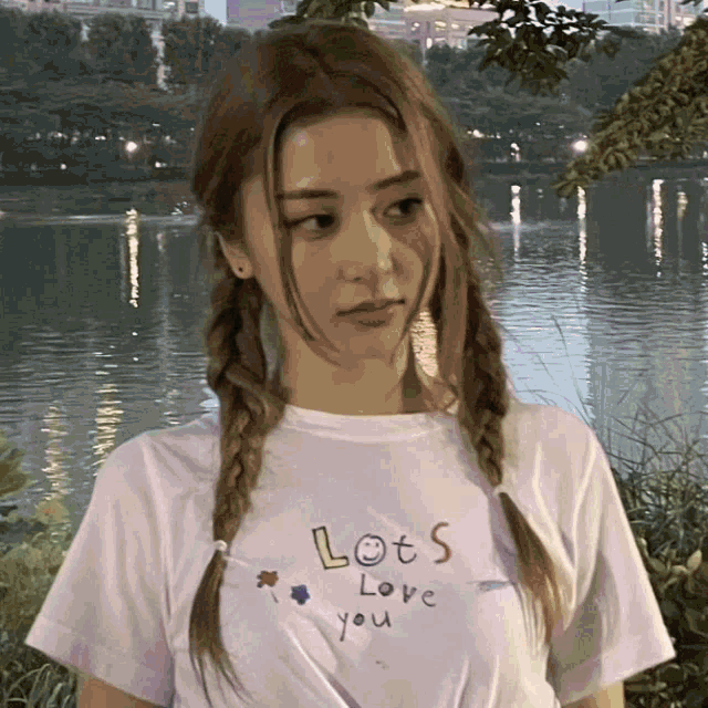 a girl wearing a t-shirt that says lots love you