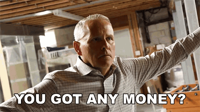 a man in a plaid shirt is asking if he has money