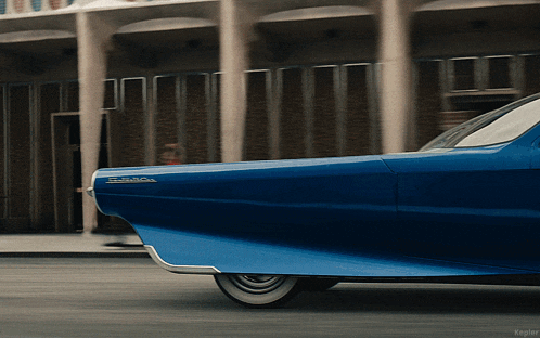 a blue car with the word thunderbird on the front