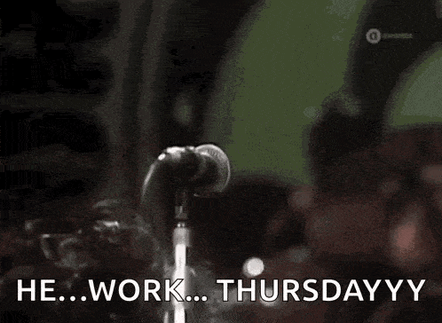 a man is singing into a microphone and says he work thursday