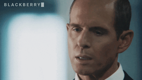 a close up of a man 's face with blackberry written in the corner