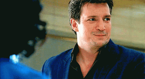 a man in a blue suit looks at another man