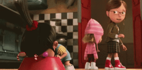three cartoon characters from despicable me are standing next to each other in a kitchen .