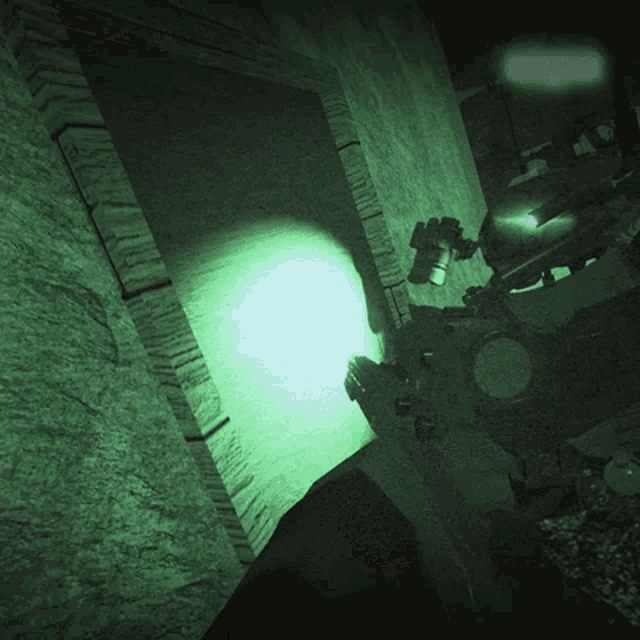 a green light is shining on a wall with a shadow on it