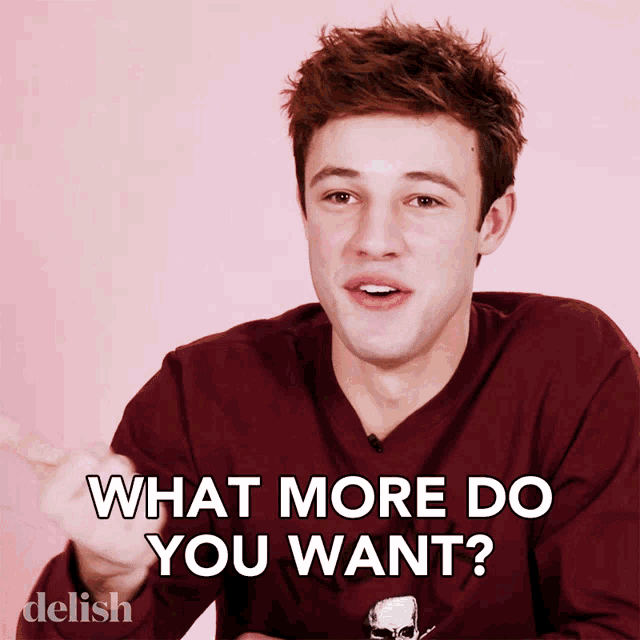 a young man in a maroon shirt is asking what more do you want