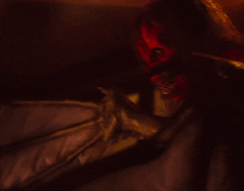 a close up of a person with blood on their face and arms