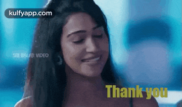 a woman is smiling and saying thank you in a video