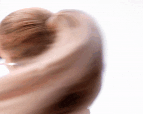 a blurred image of a person 's face and hair
