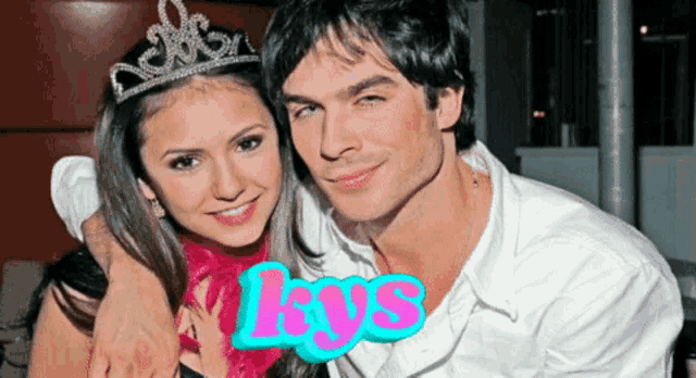 a woman wearing a tiara and a man wearing a white shirt are standing next to each other with the word lys in pink
