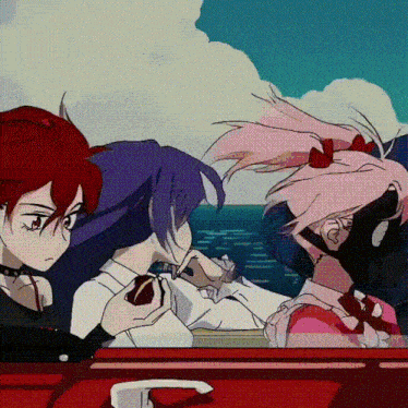 a group of anime girls are sitting in a red car near the ocean