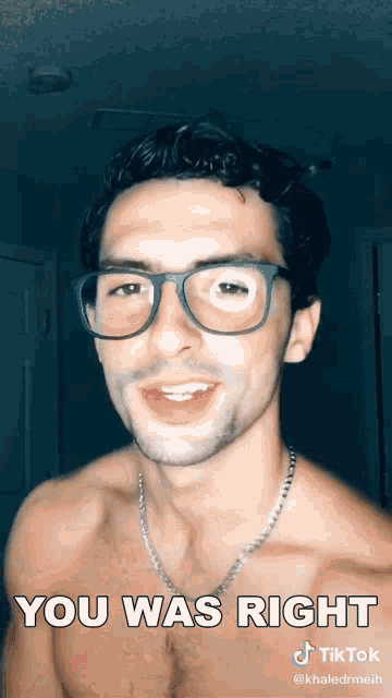 a shirtless man wearing glasses and a necklace with the caption you was right
