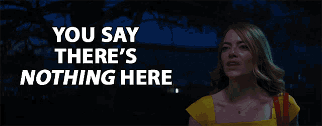 a woman in a yellow dress is standing in front of a sign that says " you say there 's nothing here "