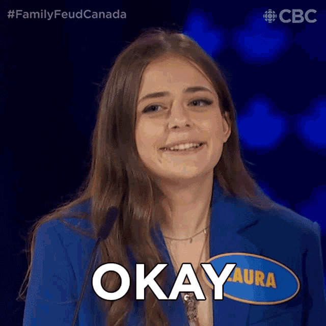 a woman with a name tag that says okay on it