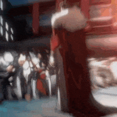 a blurry picture of a man in a red robe