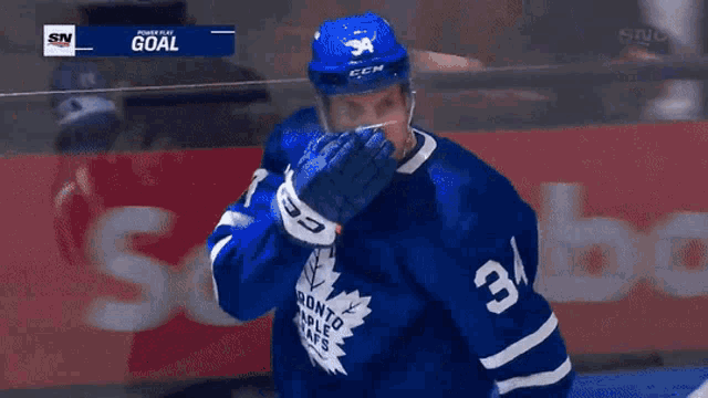 a toronto maple leafs hockey player wearing number 34