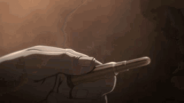 a close up of a person holding a pen